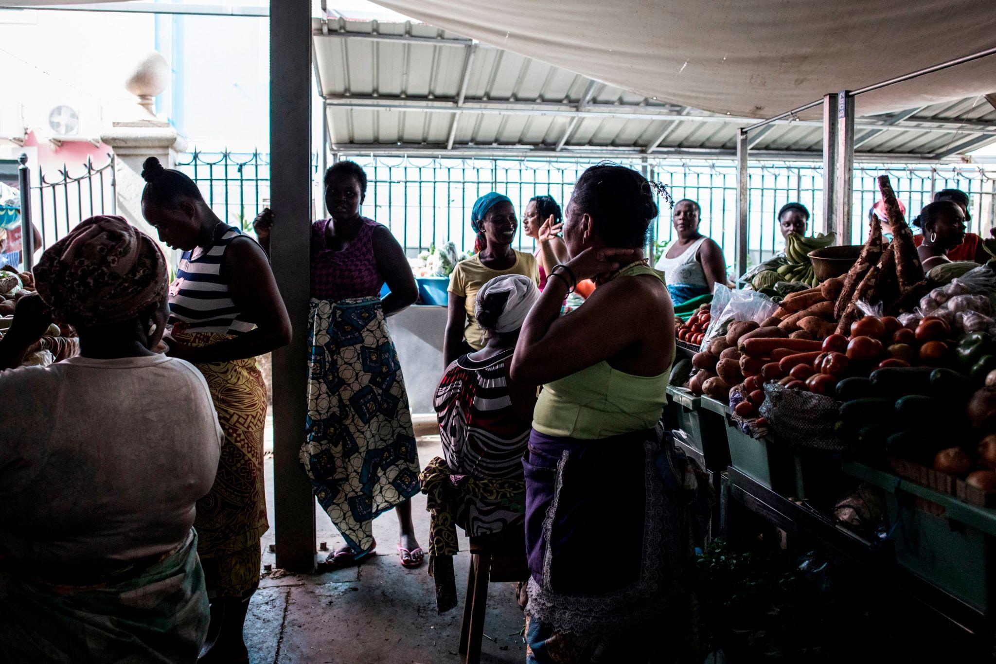 Women gathered at a Cape Verdean produce market