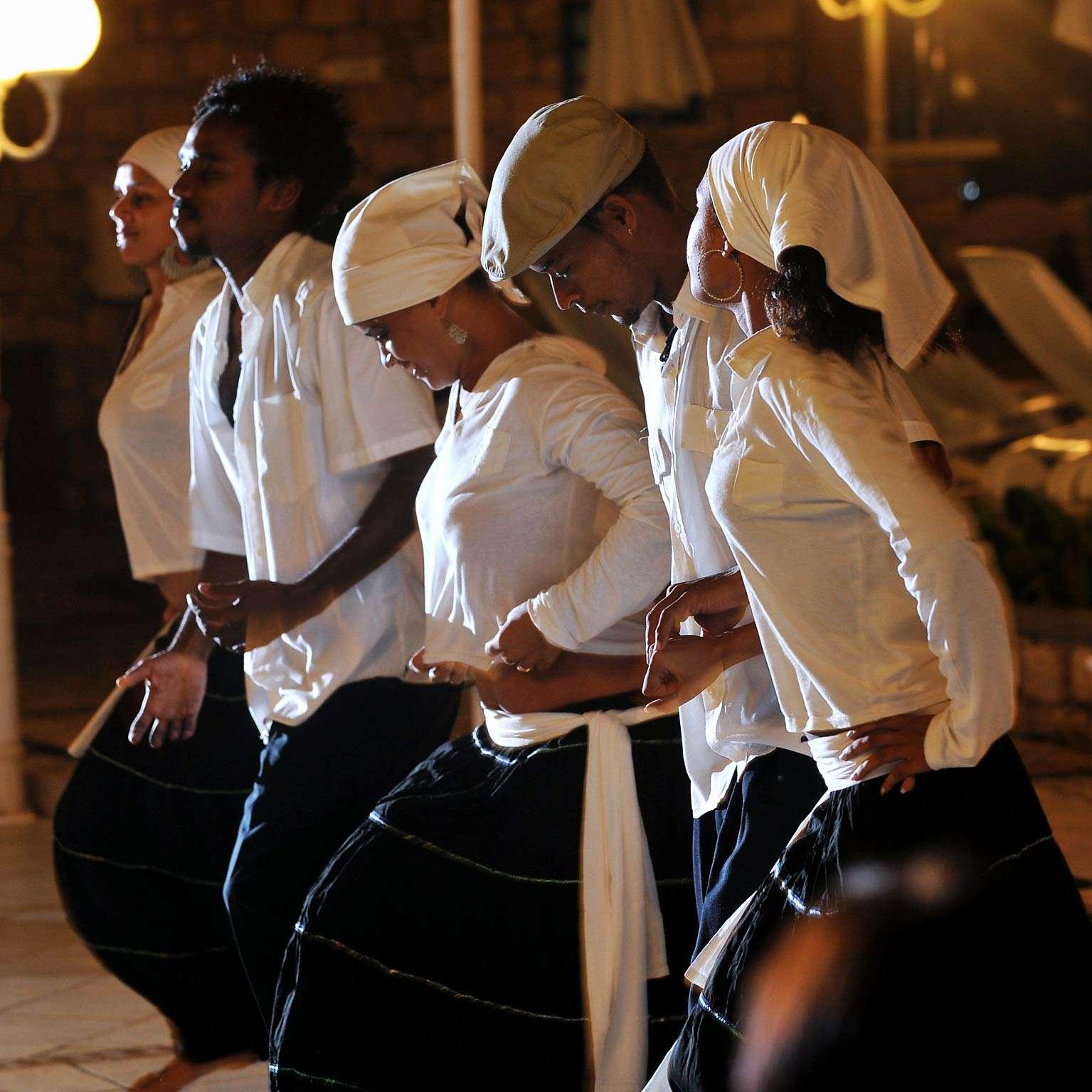 Cape Verdean dancers in traditional dress performing at a Mindelo music night, São Vicente