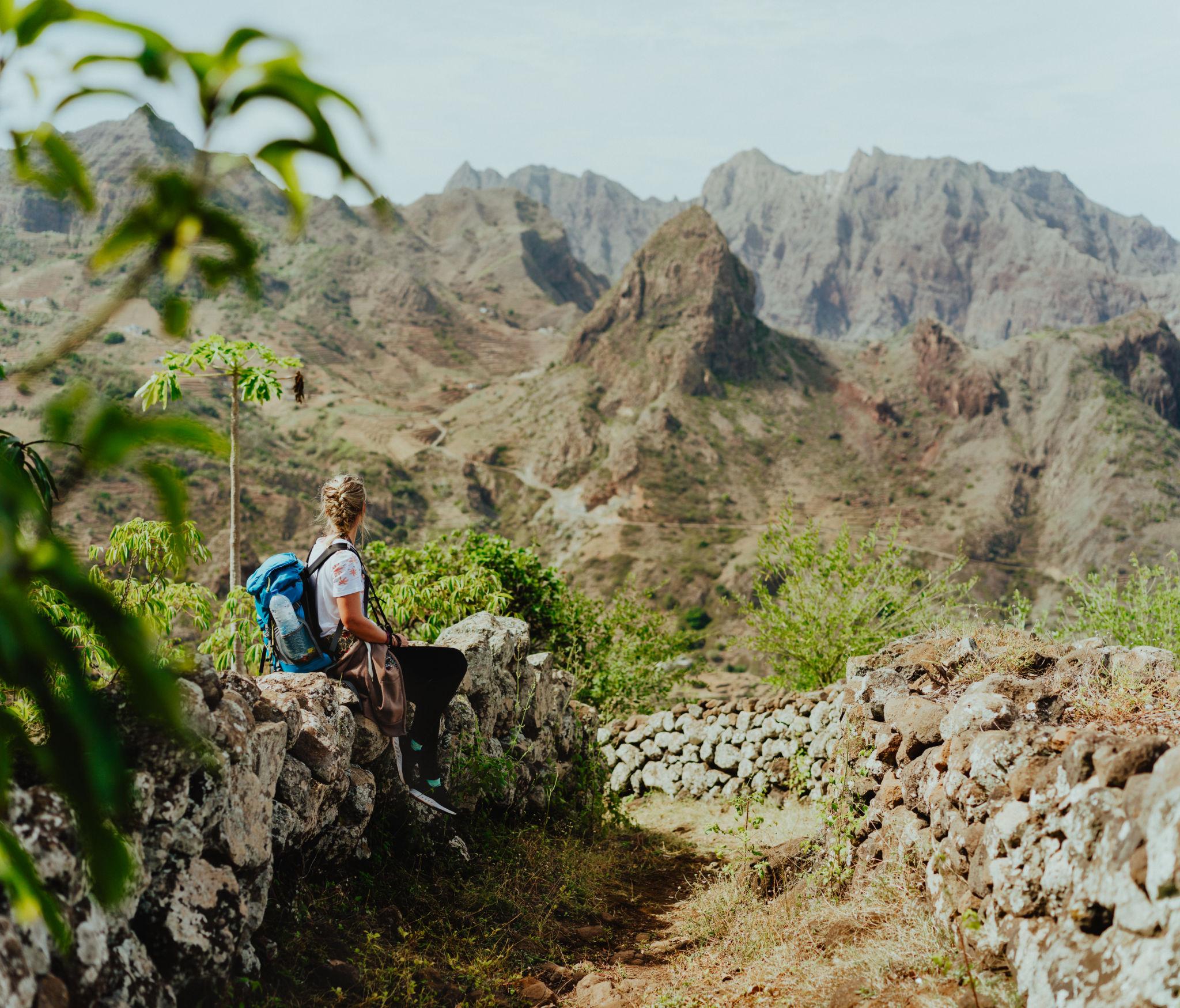 Hiker overlooking rugged Santo Antão mountains in Cape Verde